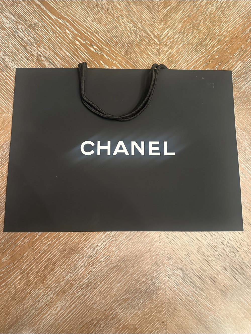 CHANEL Black Paper Shopping Bag with White Logo